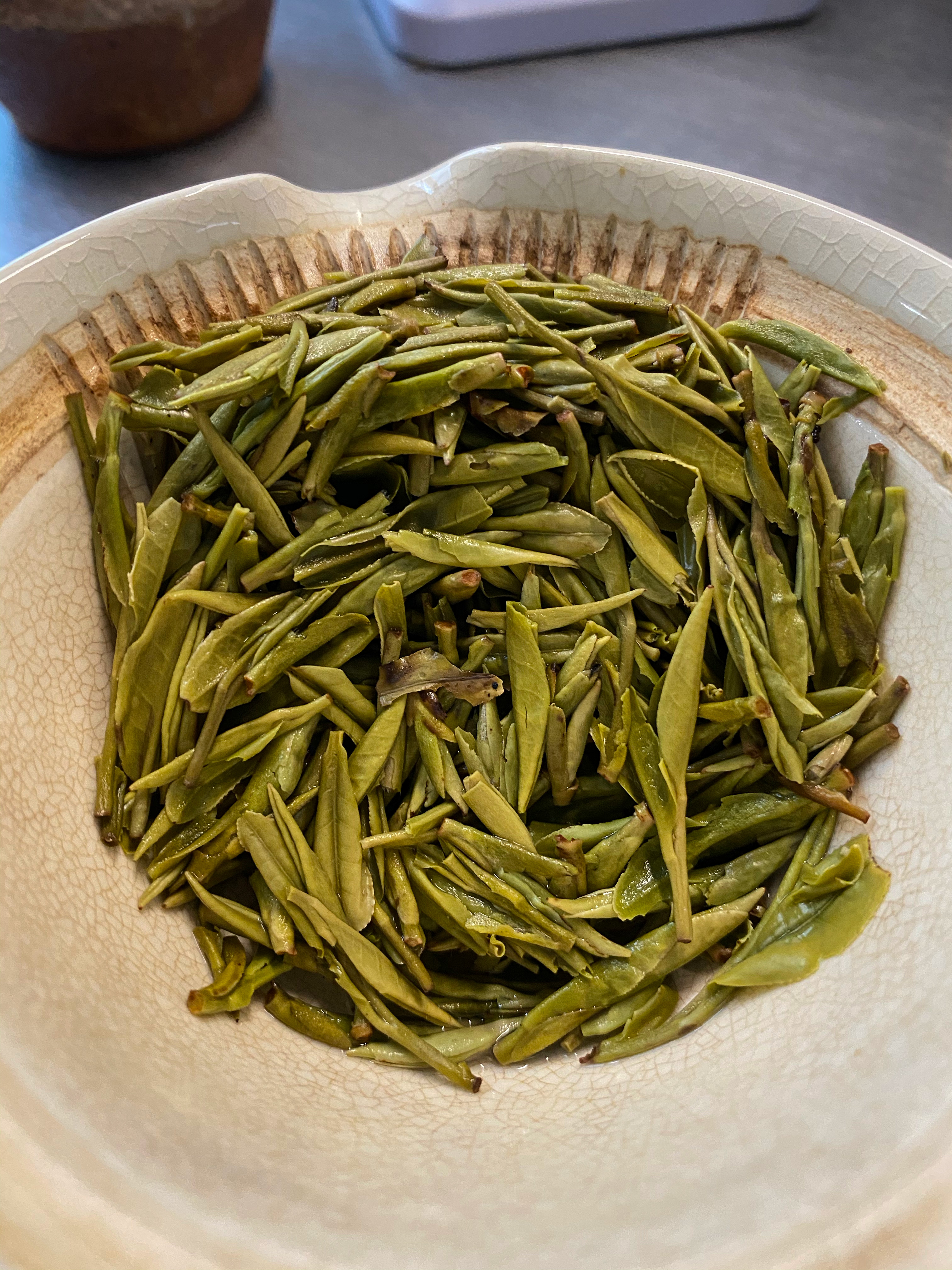 Leaves after 6 infusions, about 2.5x the size of dry. More yellow and much like anji bai cha in color