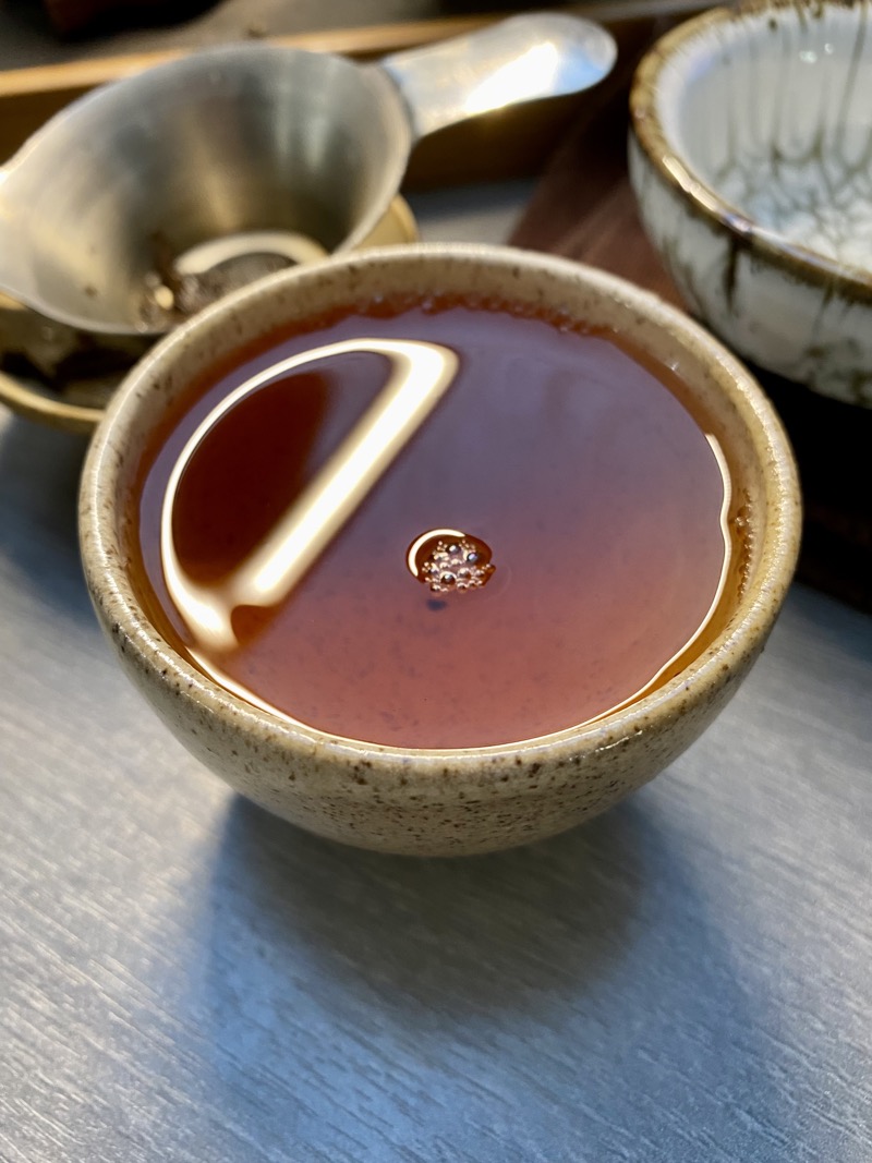 dark red tea liquor in the cup, deep into the session
